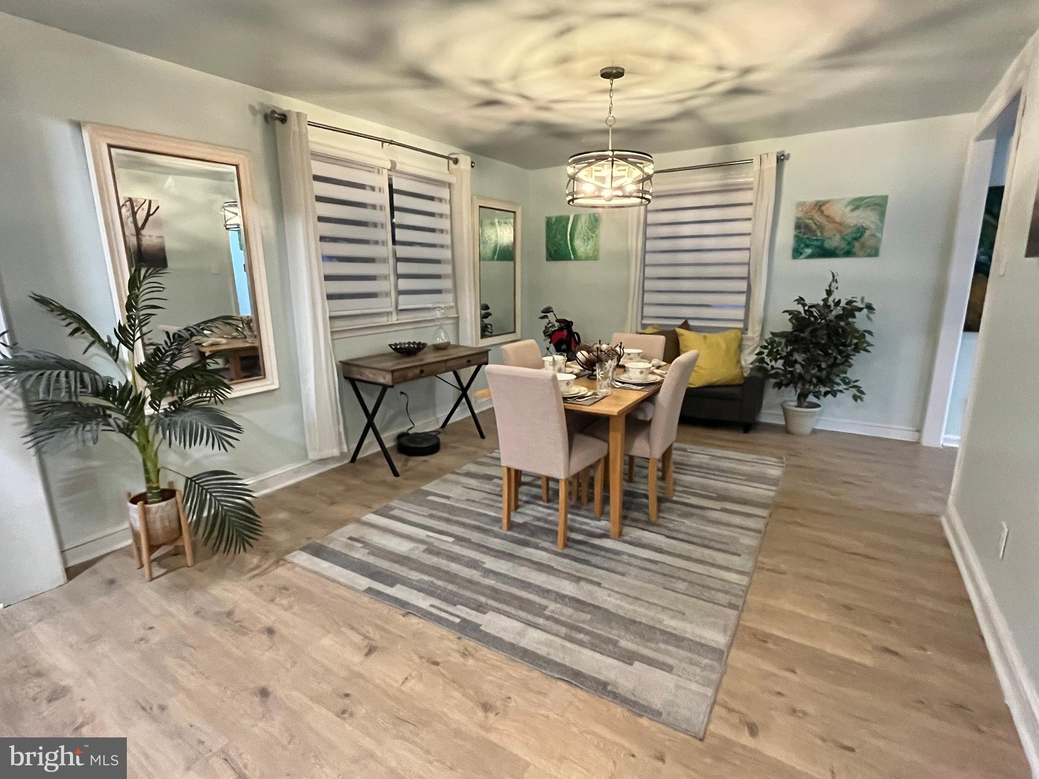 1304 Manor Road Lansdowne, PA 19050 - Photo 6 of 27 a view of a dining room with furniture and wooden floor