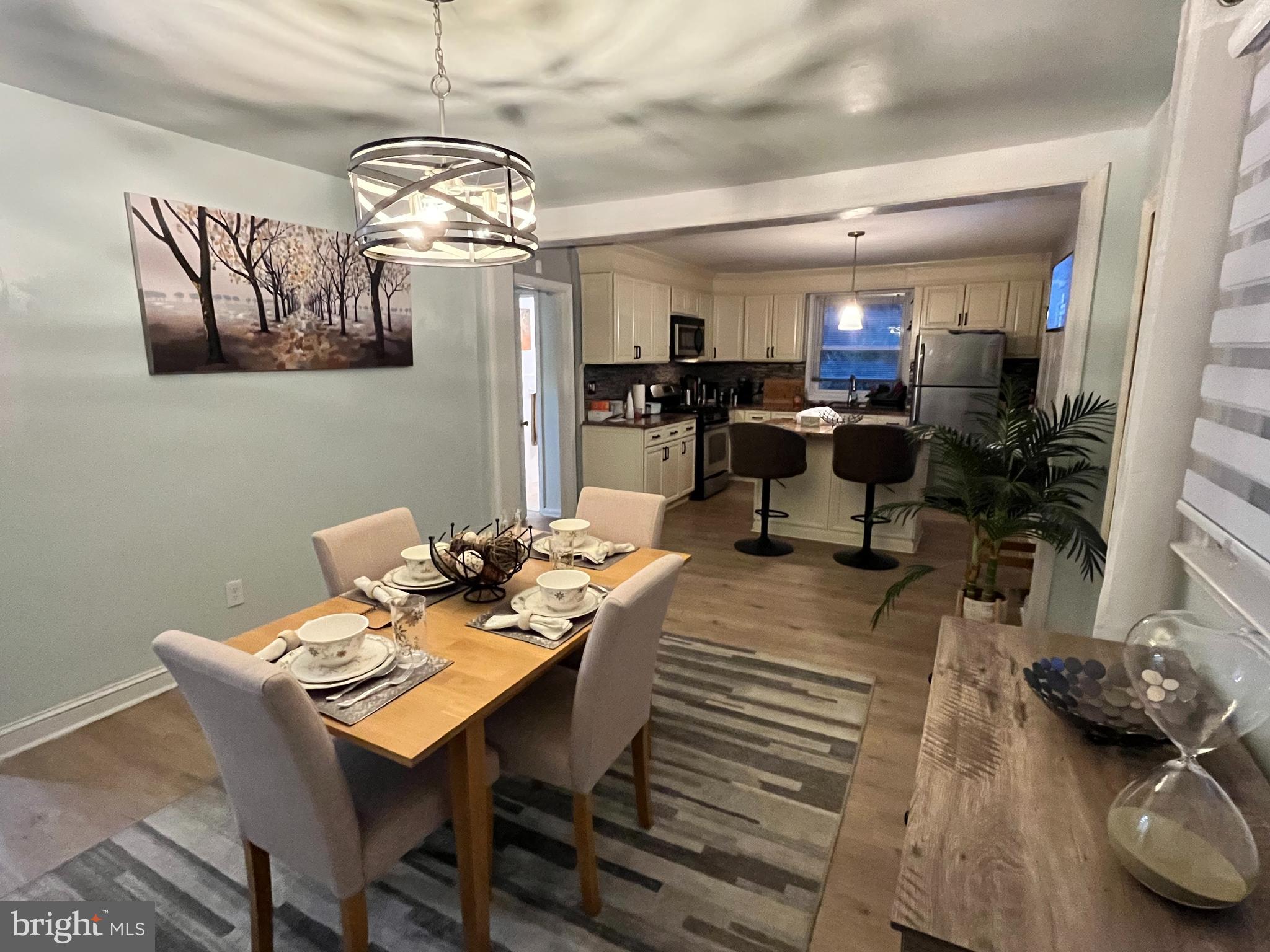 1304 Manor Road Lansdowne, PA 19050 - Photo 8 of 27 a view of a dining room with furniture and a chandelier
