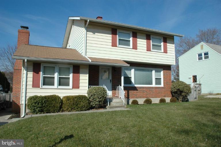 9006 Tammy Road Nottingham, MD 21236 - Photo 1 of 14 a front view of a house with a yard
