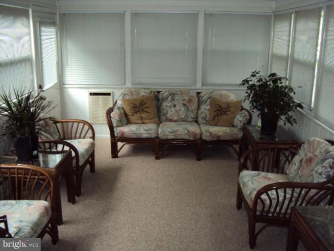 9006 Tammy Road Nottingham, MD 21236 - Photo 12 of 14 a living room with furniture and a potted plant