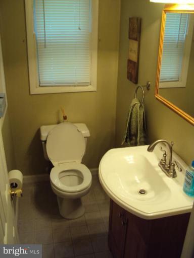 9006 Tammy Road Nottingham, MD 21236 - Photo 13 of 14 a bathroom with a sink and a toilet