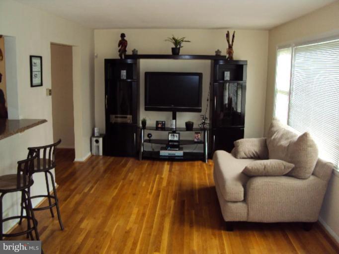 9006 Tammy Road Nottingham, MD 21236 - Photo 10 of 14 a living room with furniture and a flat screen tv