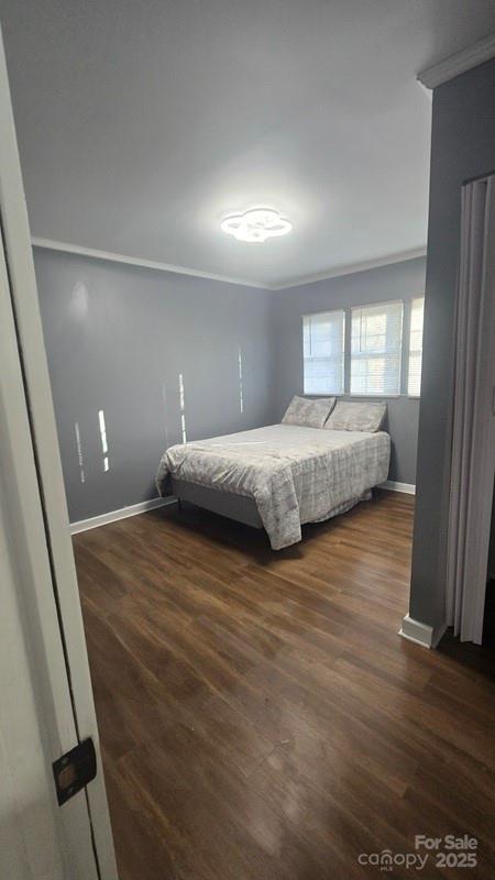 416 Oakland Road Spindale, NC 28160 - Photo 12 of 26 a bedroom with a bed and wooden floor