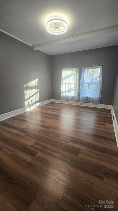 416 Oakland Road Spindale, NC 28160 - Photo 17 of 26 an empty room with wooden floor and windows