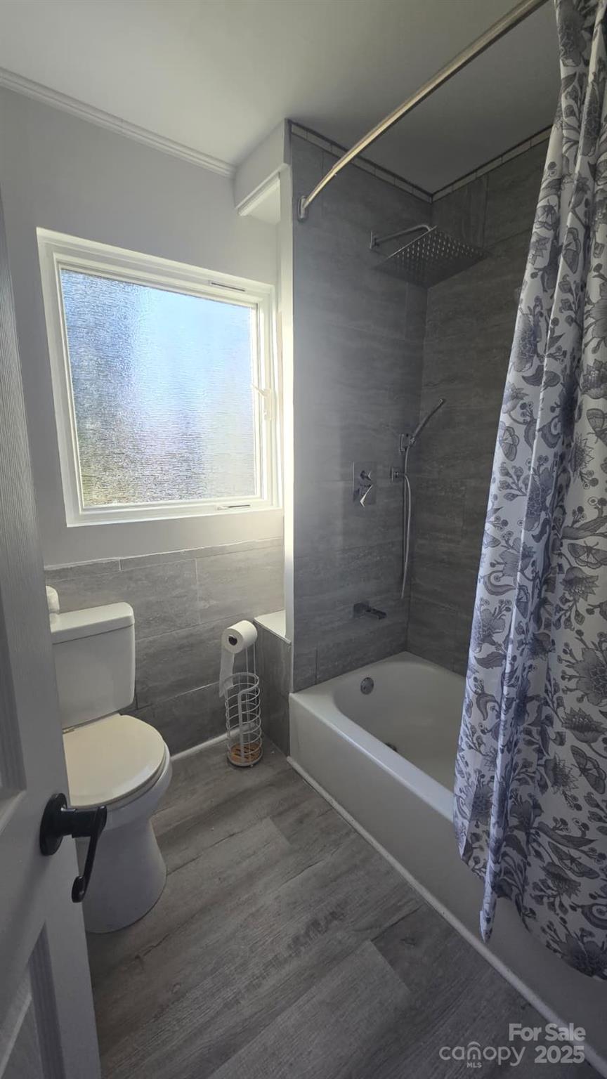 416 Oakland Road Spindale, NC 28160 - Photo 18 of 26 a bathroom with a toilet and a shower