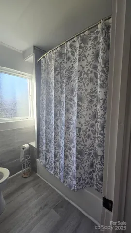 a bathroom with a shower curtain
