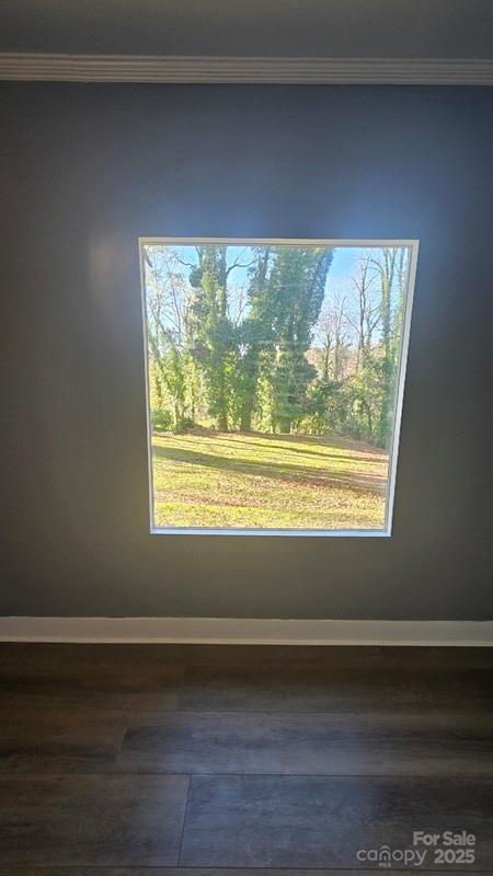 416 Oakland Road Spindale, NC 28160 - Photo 21 of 26 a view of an empty room with wooden floor and a window