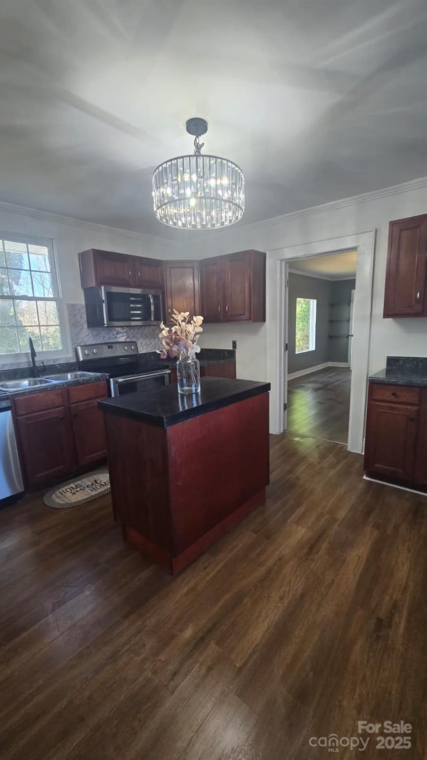 416 Oakland Road Spindale, NC 28160 - Photo 9 of 26 a living room with furniture and a chandelier