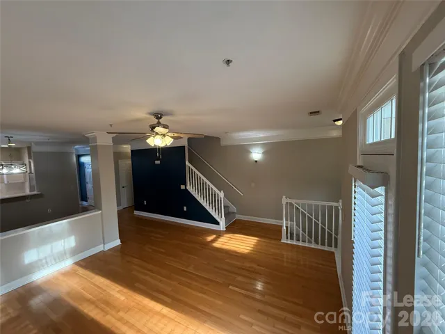 a view of entryway dining room and hall with wooden floor