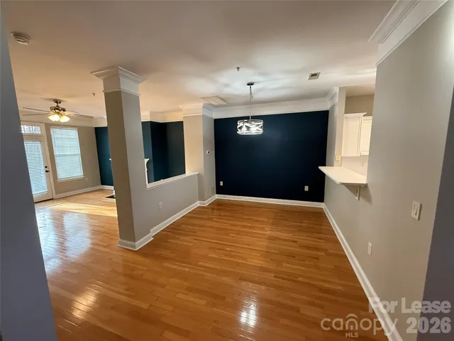 a view of a hallway with a kitchen