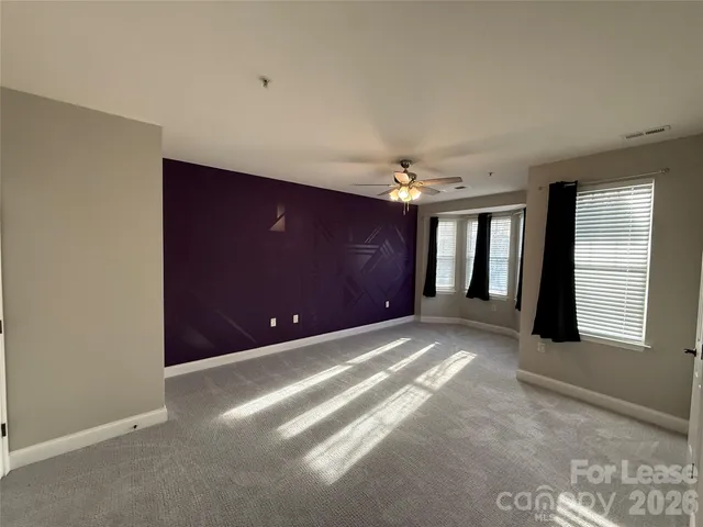 a bathroom with a toilet a sink and a mirror