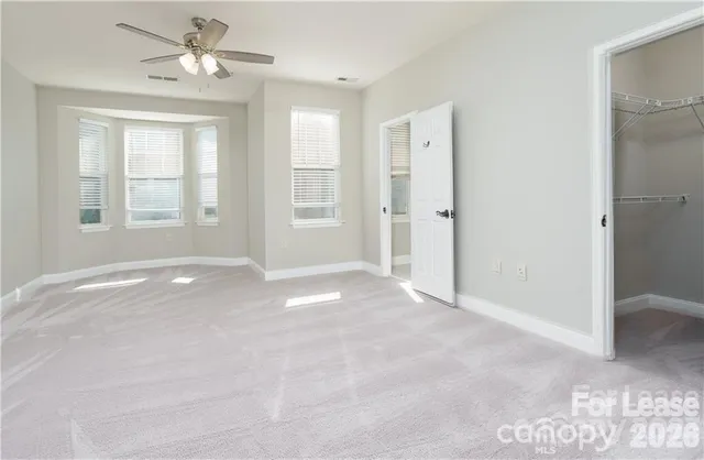 a bathroom with a sink a toilet a mirror and shower