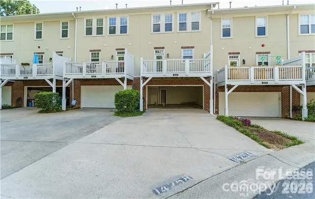 a view of a patio with table and chairs