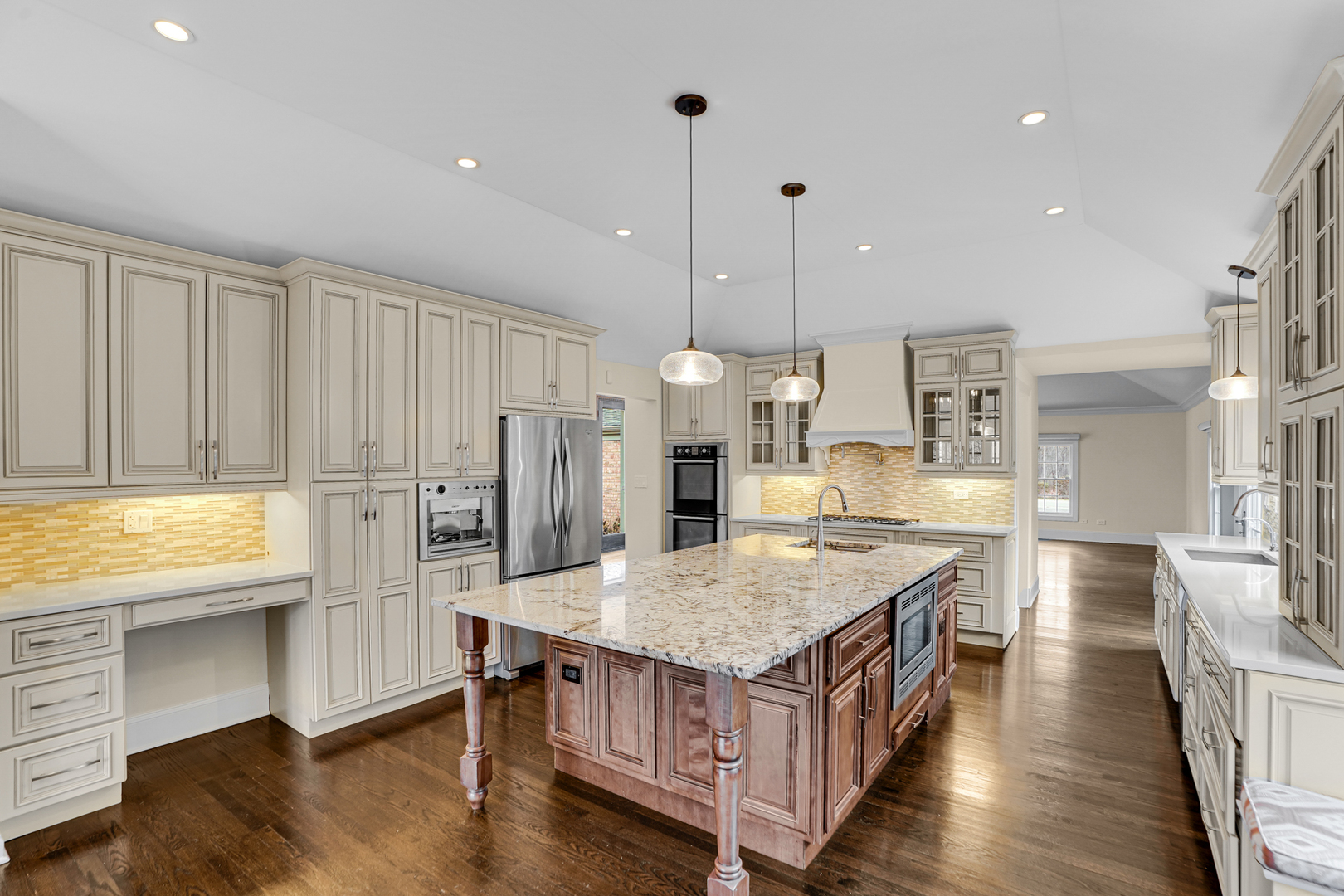 104 Moffett Road Lake Bluff, IL 60044 - Photo 11 of 40 a kitchen with a table chairs refrigerator and wooden floor