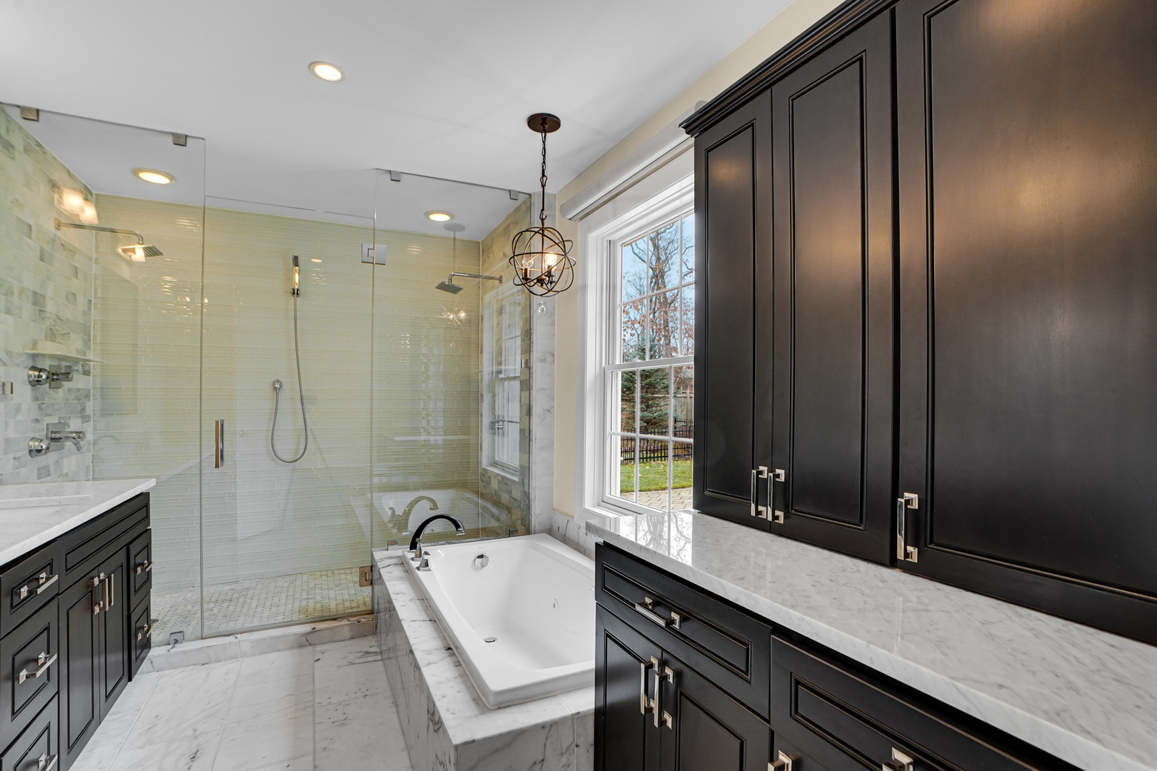 104 Moffett Road Lake Bluff, IL 60044 - Photo 15 of 40 a spacious bathroom with a granite countertop sink mirror and a bathtub
