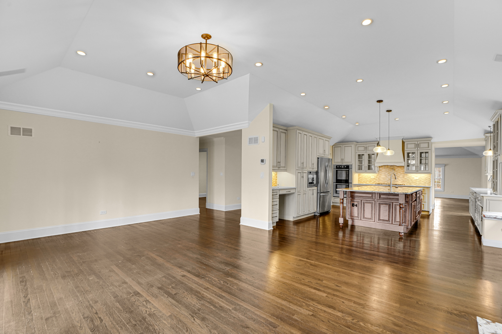 104 Moffett Road Lake Bluff, IL 60044 - Photo 8 of 40 a living room with couches and kitchen view with wooden floor