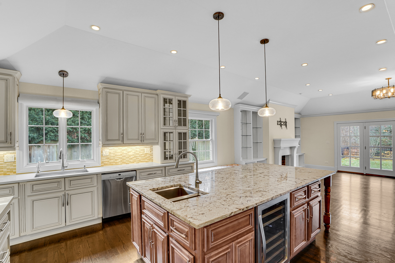 104 Moffett Road Lake Bluff, IL 60044 - Photo 10 of 40 a kitchen with stainless steel appliances granite countertop a sink a stove and a wooden floors