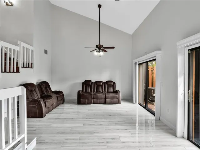 a view of a bedroom with a large bed and dresser