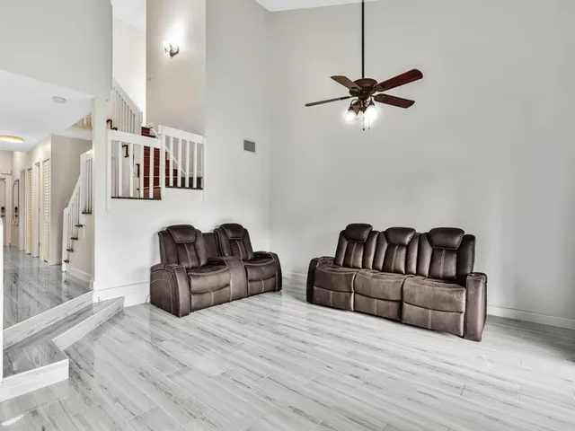 a view of a park with a bench and trees