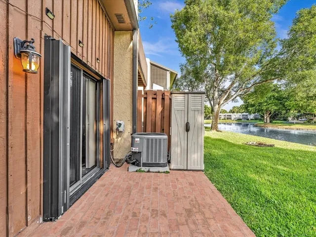 a view of a house with a yard and porch
