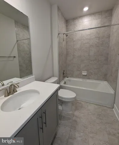 a white bath tub sitting in a bathroom