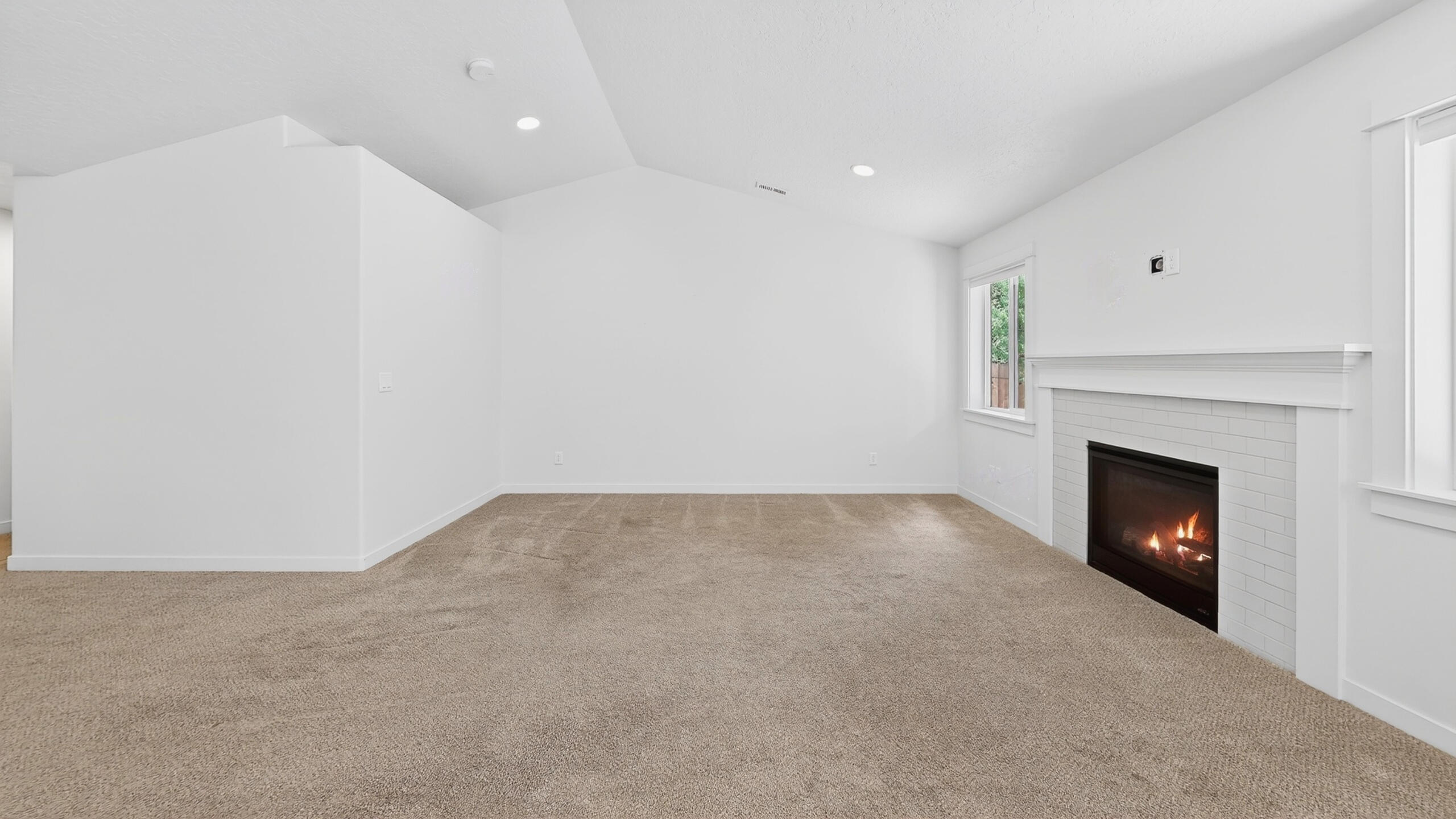 680 McKinney Ranch Road Sisters, OR 97759 - Photo 16 of 41 a view of an empty room with a fireplace