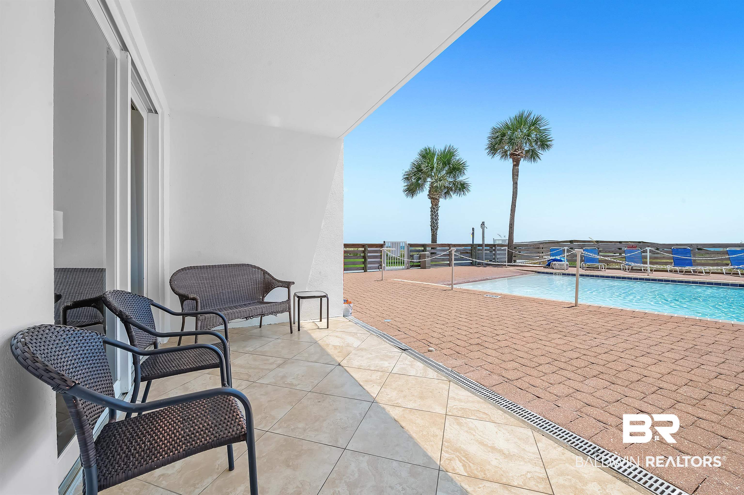 16287 Perdido Key Drive, Unit 105 Pensacola, FL 32507 - Photo 39 of 66 Outdoor patio with tile flooring and sliding glass door access