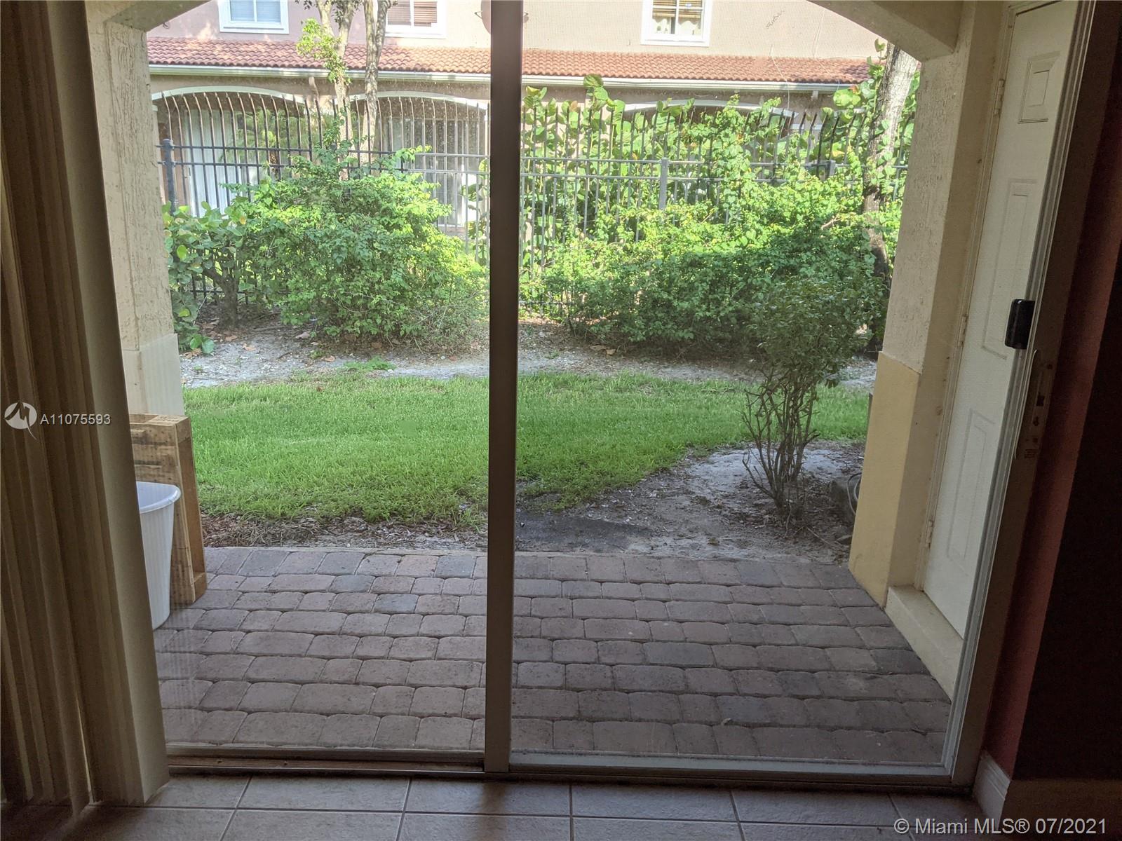 2731 Southwest 83rd Terrace, Unit 101 Miramar, FL 33025 - Photo 26 of 28 a view of a porch with a table in balcony