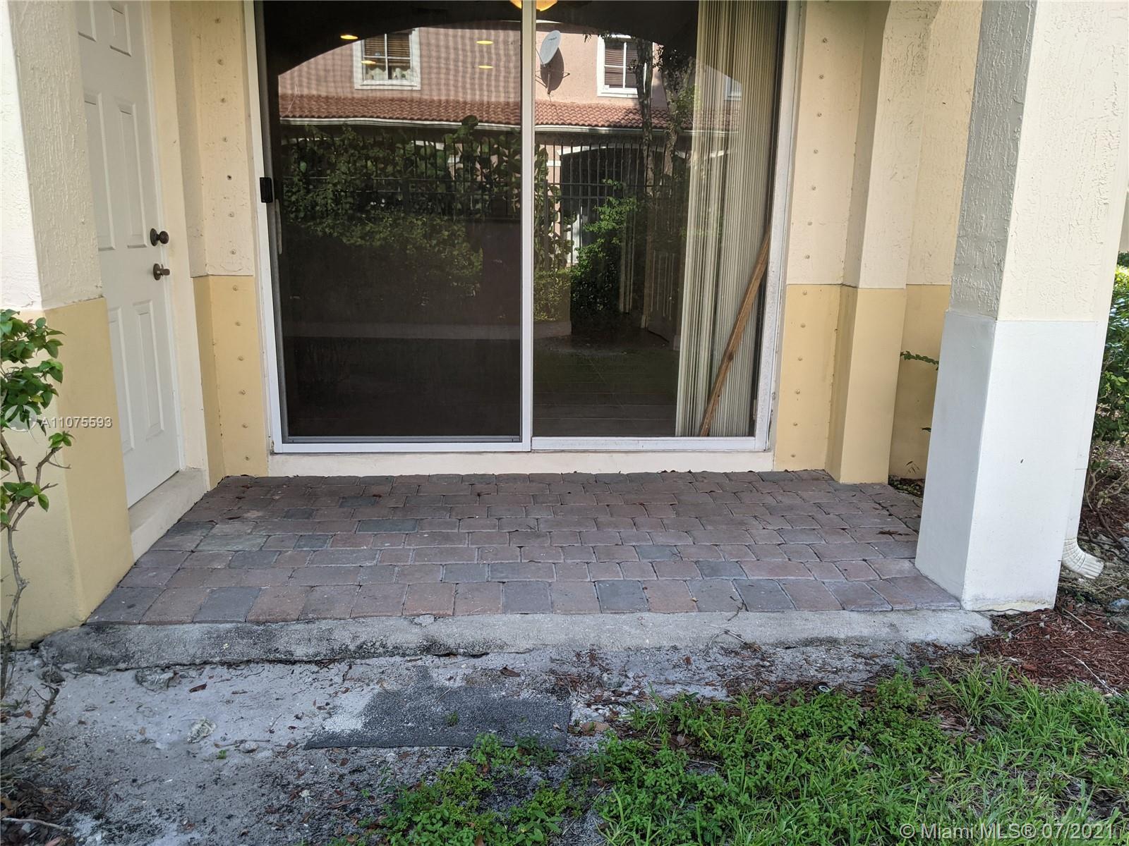 2731 Southwest 83rd Terrace, Unit 101 Miramar, FL 33025 - Photo 27 of 28 a view of a glass door