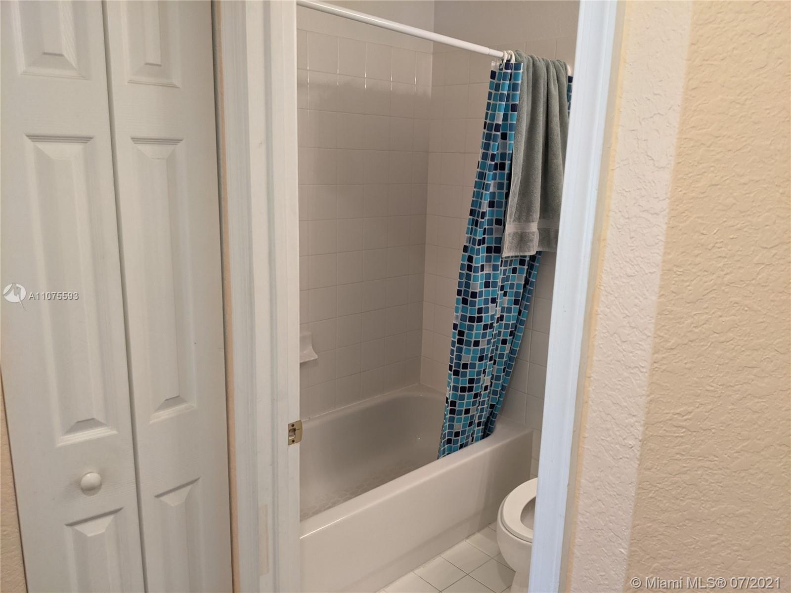 2731 Southwest 83rd Terrace, Unit 101 Miramar, FL 33025 - Photo 4 of 28 a bathroom with a shower and a sink