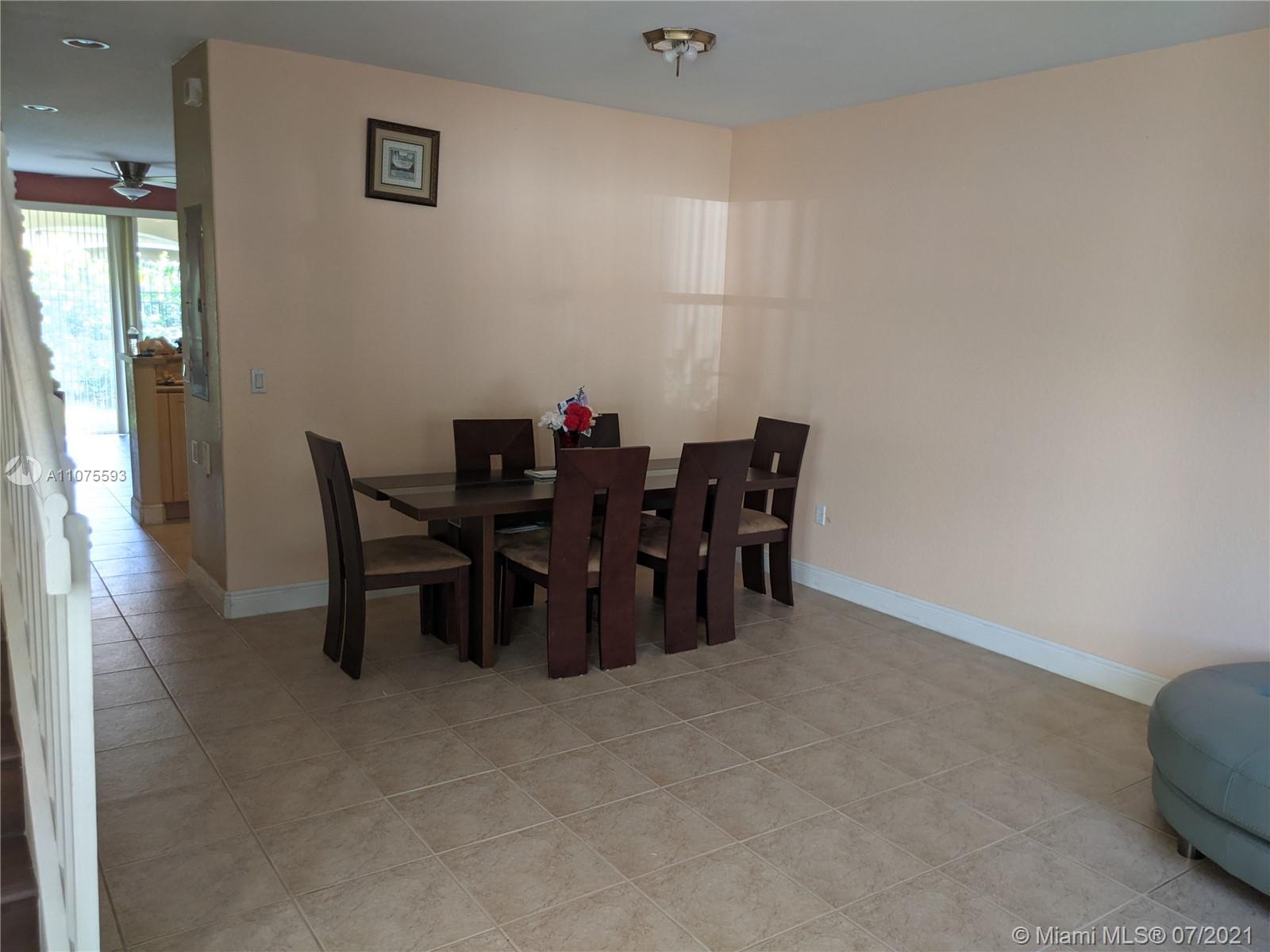 2731 Southwest 83rd Terrace, Unit 101 Miramar, FL 33025 - Photo 5 of 28 a view of a dining room with furniture