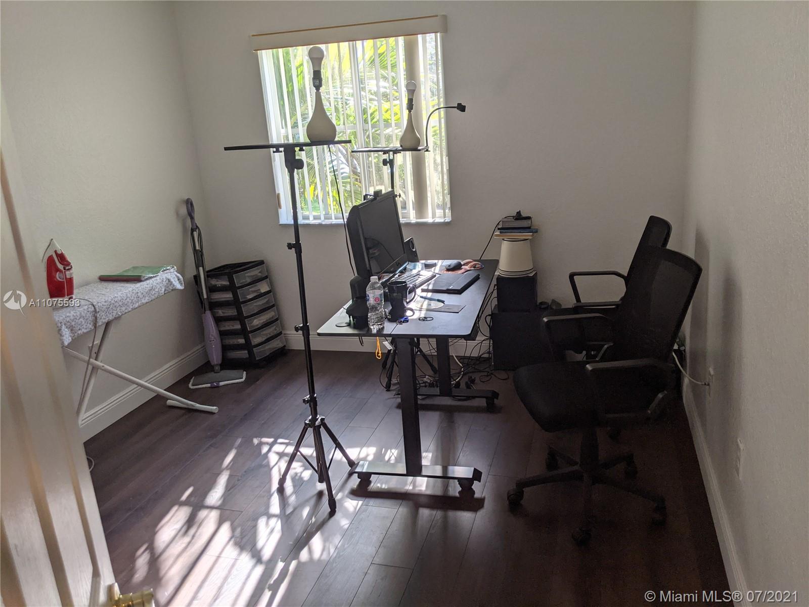 2731 Southwest 83rd Terrace, Unit 101 Miramar, FL 33025 - Photo 6 of 28 a view of a workspace with furniture and a window