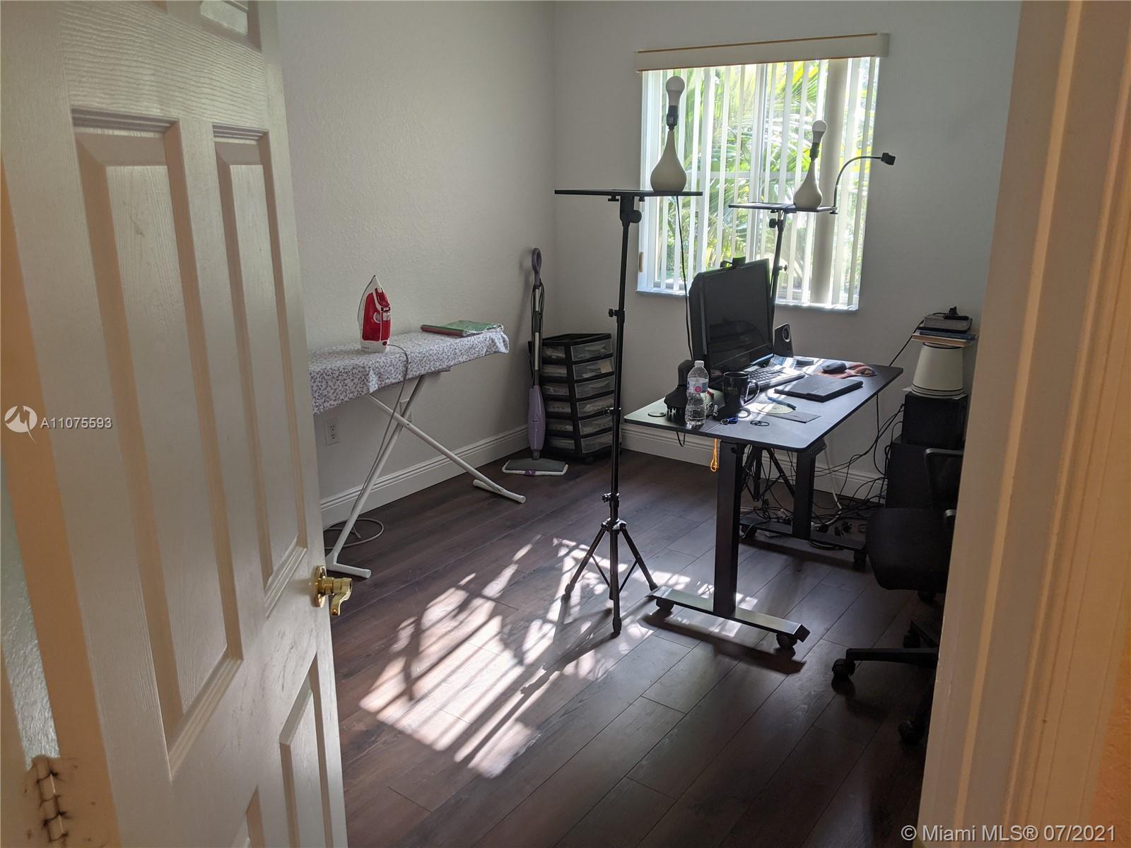 2731 Southwest 83rd Terrace, Unit 101 Miramar, FL 33025 - Photo 7 of 28 a view of a workspace with furniture and a window