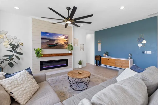 a view of a dining room with furniture large windows and wooden floor