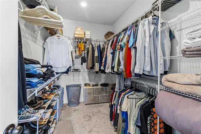a view of a workspace with furniture and a potted plant