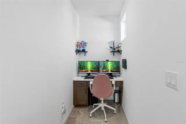 a bedroom with a bed and a ceiling fan
