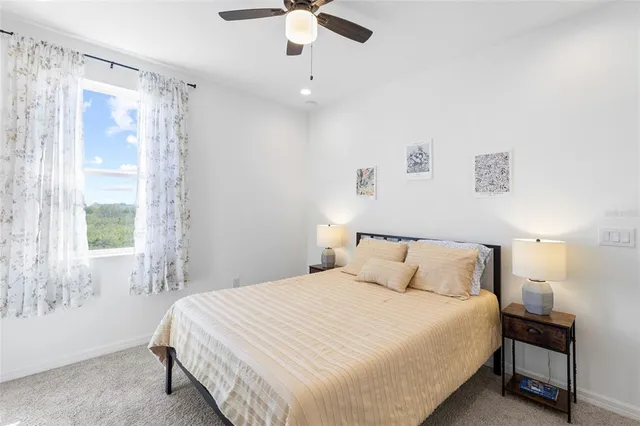 an aerial view of residential houses with outdoor space and ocean view