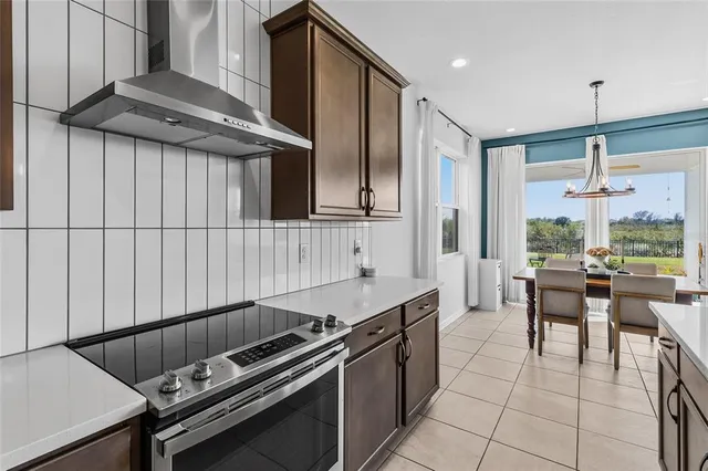 a kitchen with stainless steel appliances a sink stove and refrigerator
