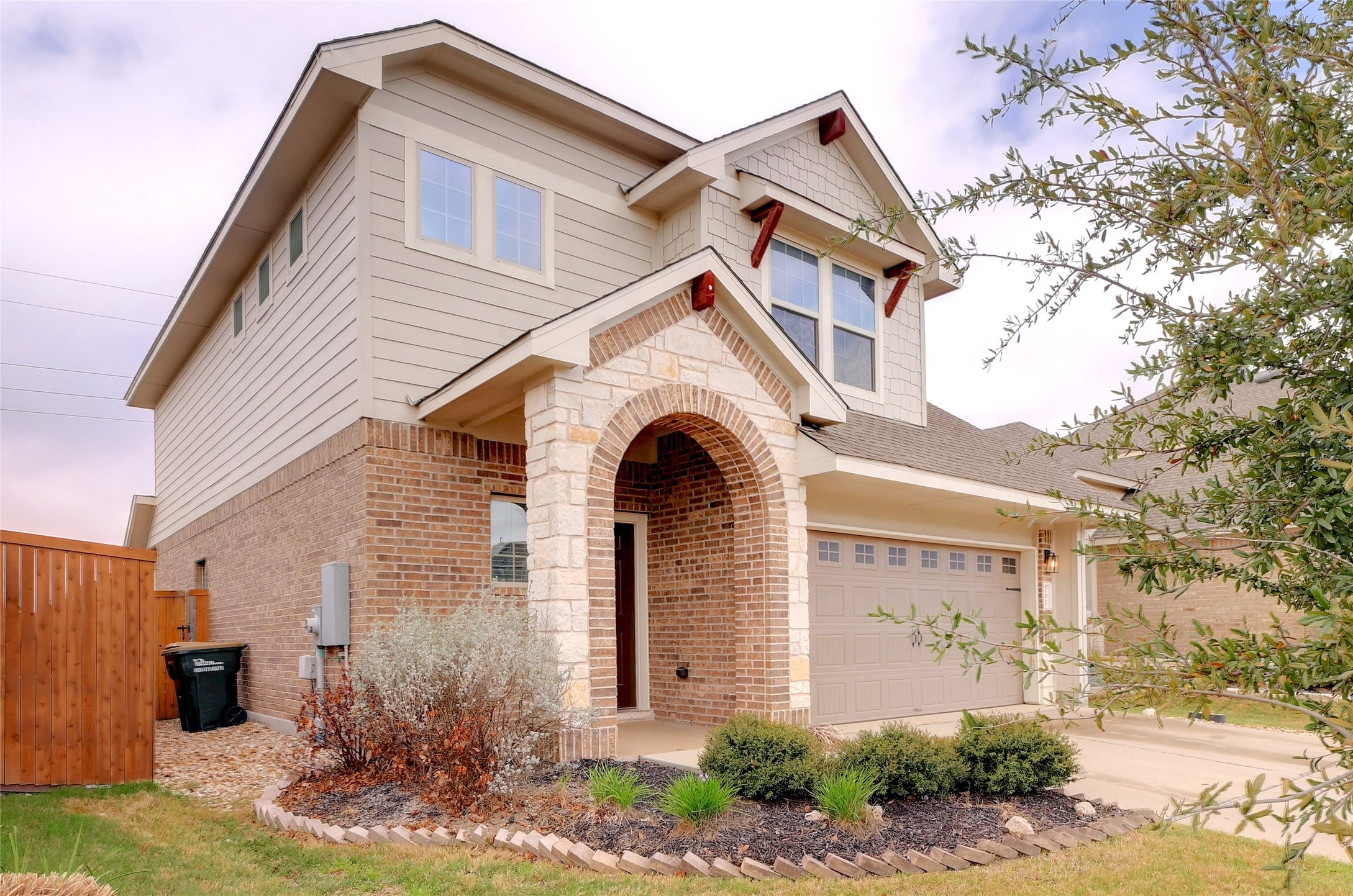 702 Nautical Loop Kyle, TX 78640 - Photo 2 of 27 This property features a brick and stone exterior with siding on the upper level