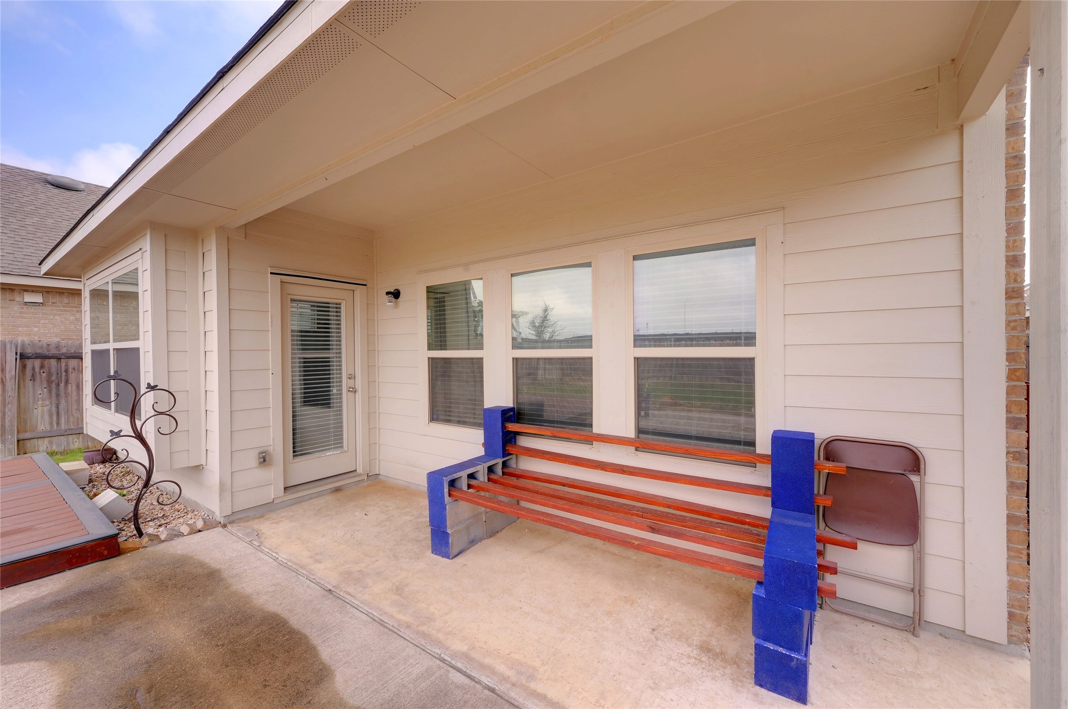 702 Nautical Loop Kyle, TX 78640 - Photo 27 of 27 The property features a covered patio with a concrete floor, offering an outdoor living space
