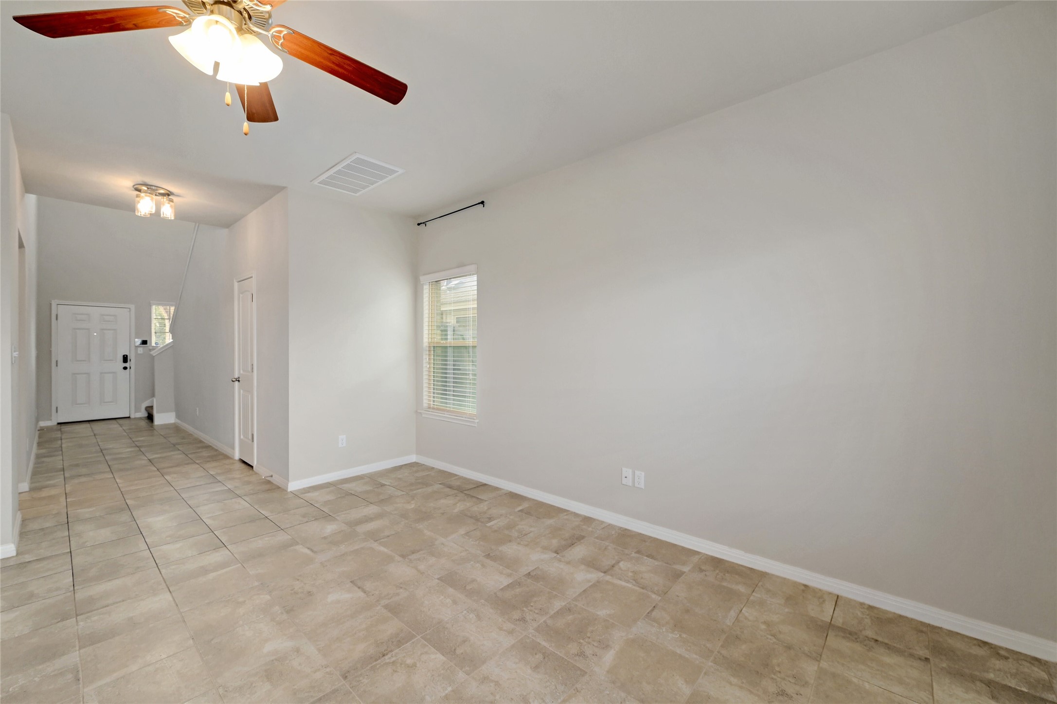 702 Nautical Loop Kyle, TX 78640 - Photo 6 of 27 The interior features neutral wall paint and tile flooring, offering a versatile foundation
