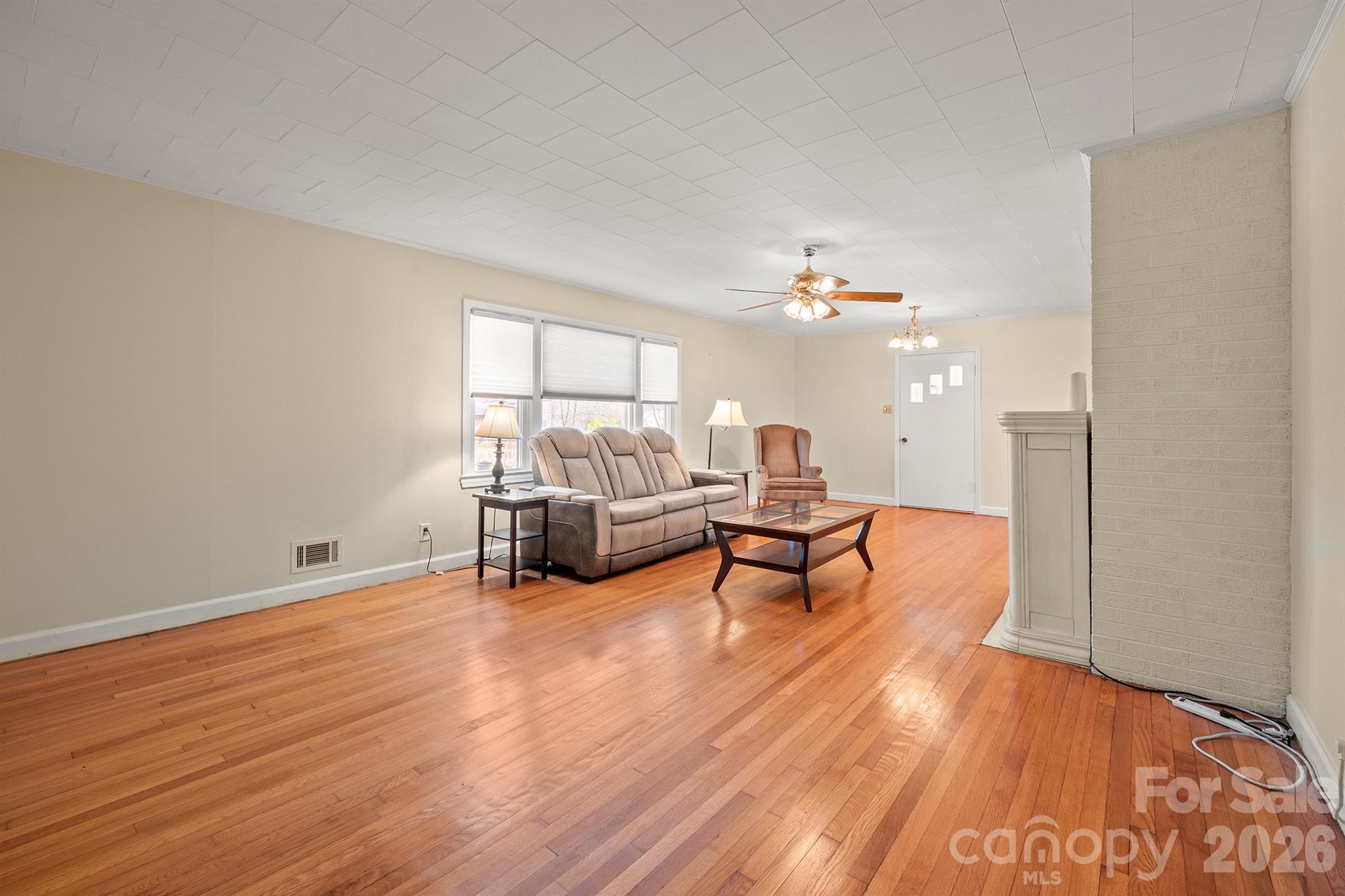 6264 Highway 221 Marion, NC 28752 - Photo 12 of 41 a living room with furniture and a wooden floor