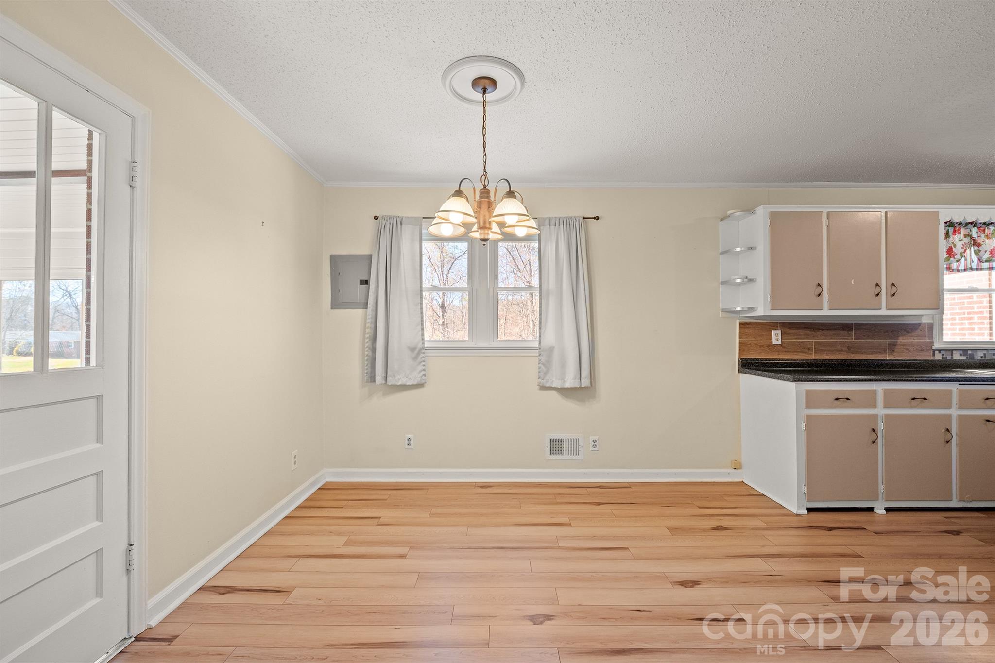 6264 Highway 221 Marion, NC 28752 - Photo 16 of 41 a view of a kitchen with wooden floor and electronic appliances