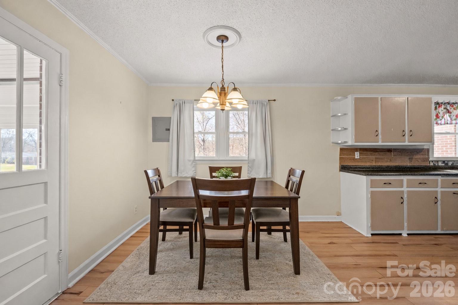 6264 Highway 221 Marion, NC 28752 - Photo 17 of 41 a view of a dining room with furniture window and wooden floor
