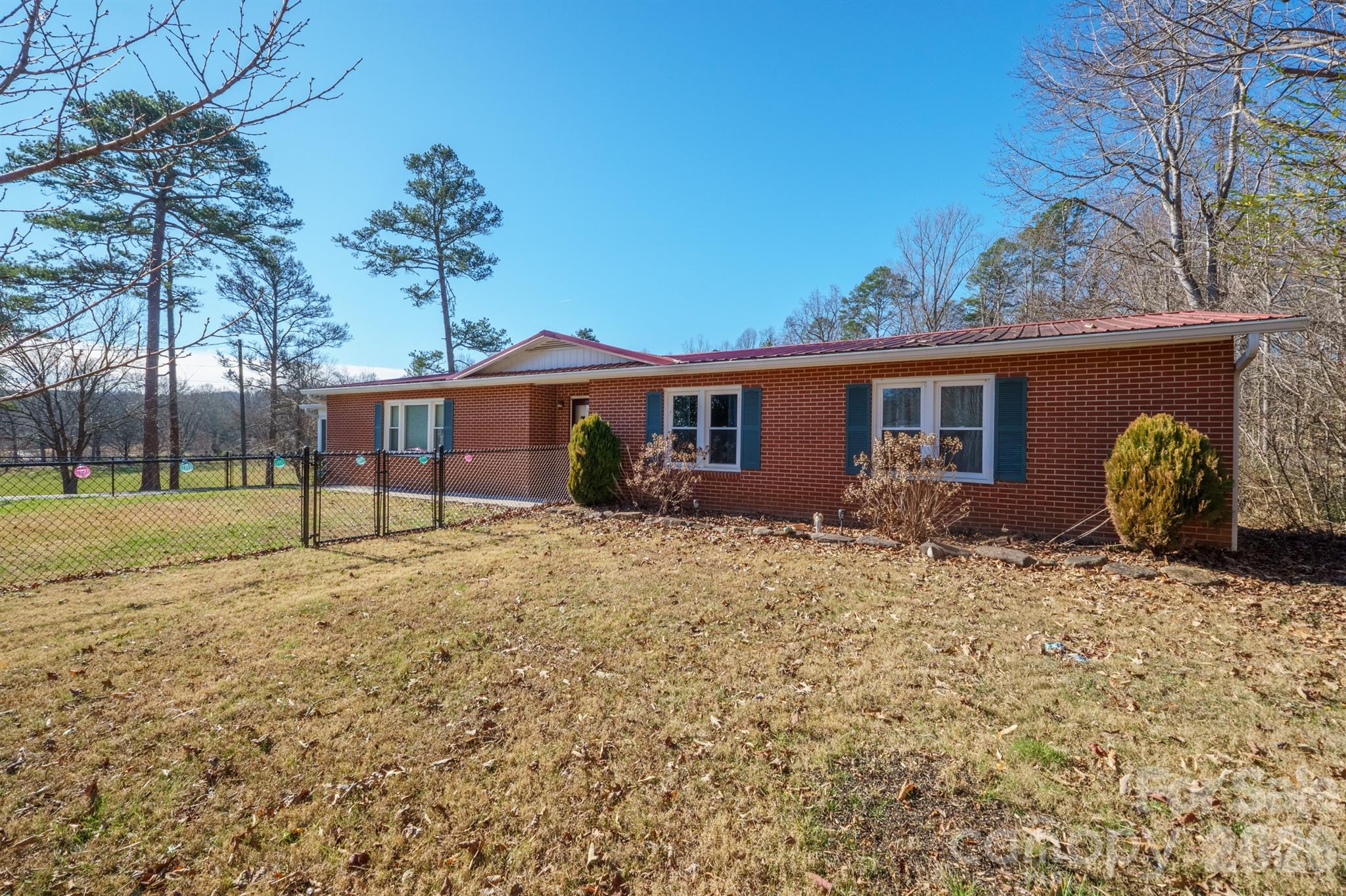 6264 Highway 221 Marion, NC 28752 - Photo 2 of 41 a front view of a house with garden