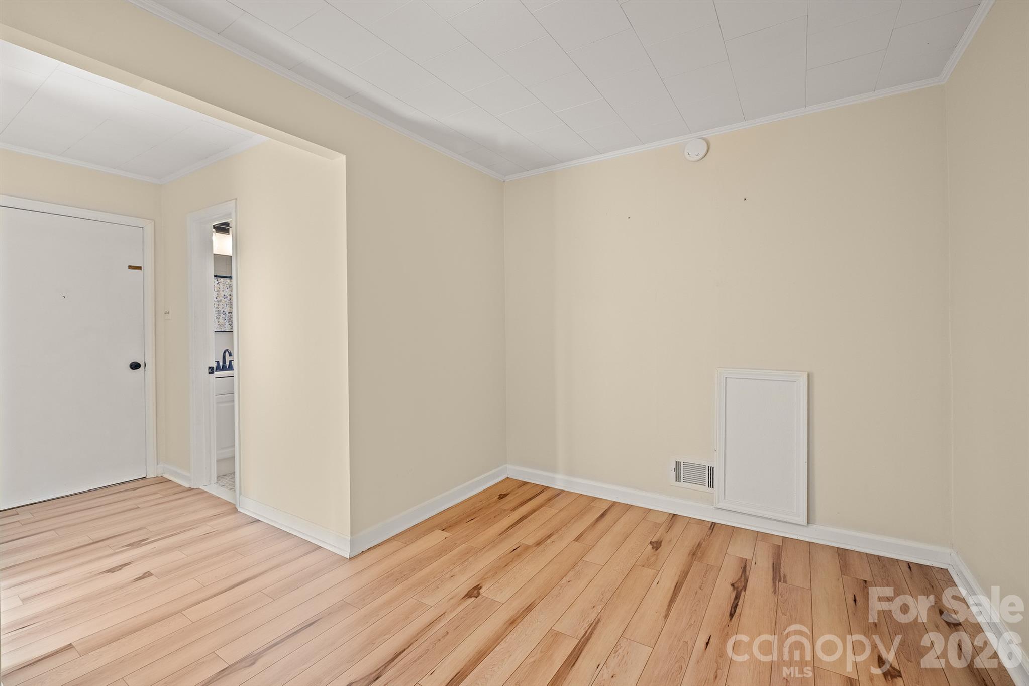 6264 Highway 221 Marion, NC 28752 - Photo 25 of 41 a view of a room with wooden floor and white walls