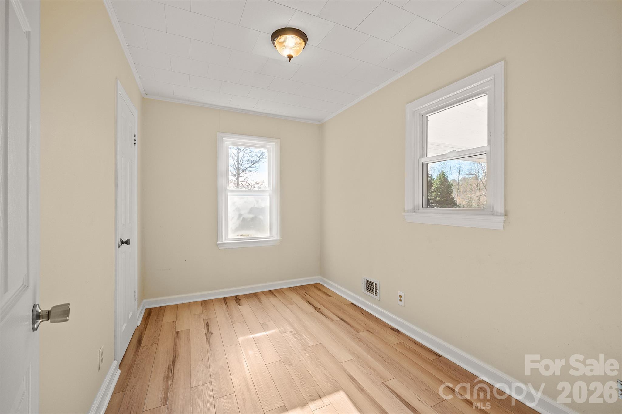 6264 Highway 221 Marion, NC 28752 - Photo 26 of 41 a view of a room with wooden floor and windows