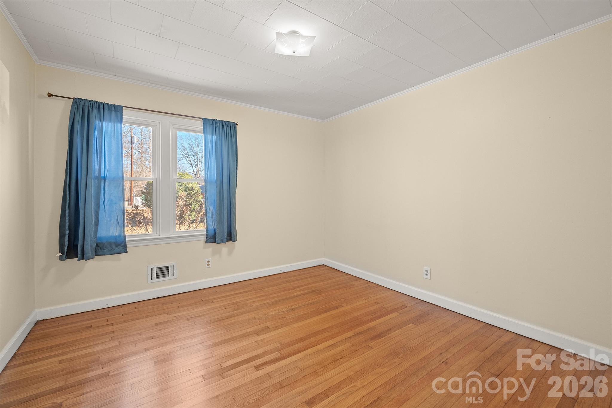 6264 Highway 221 Marion, NC 28752 - Photo 28 of 41 wooden floor in an empty room with a window