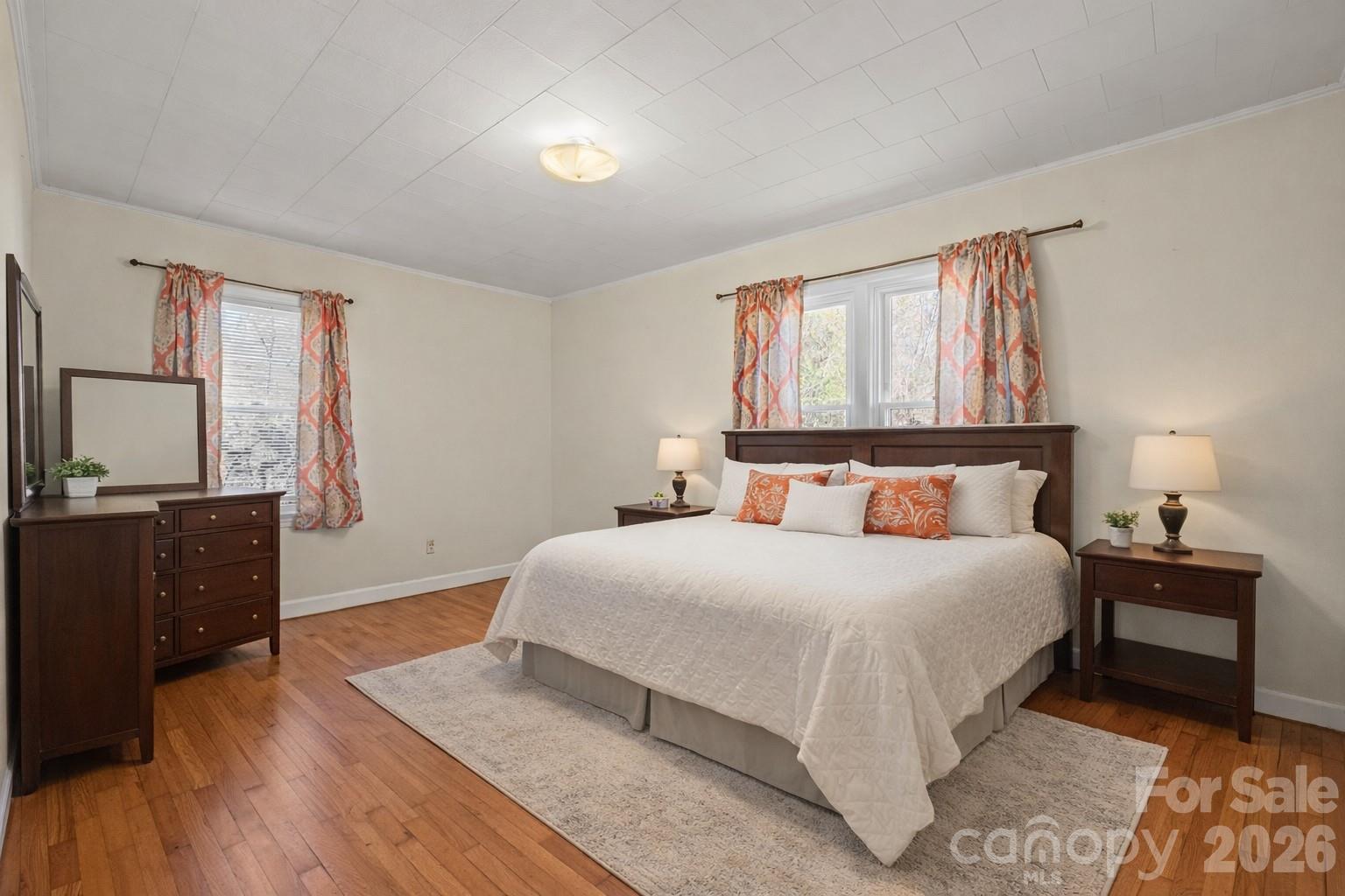 6264 Highway 221 Marion, NC 28752 - Photo 32 of 41 a bedroom with a bed and wooden floor