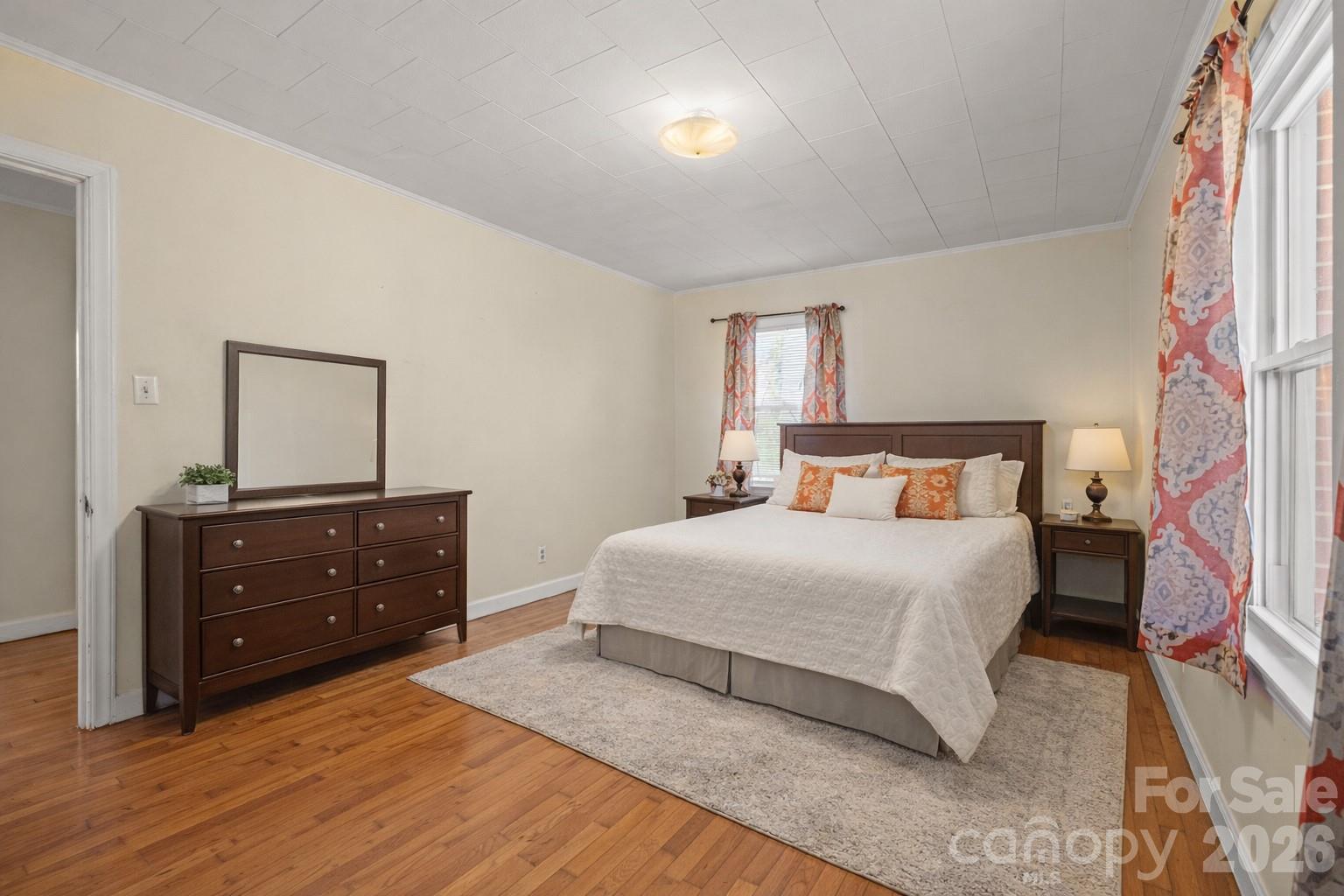 6264 Highway 221 Marion, NC 28752 - Photo 34 of 41 a bedroom with a bed and a mirror